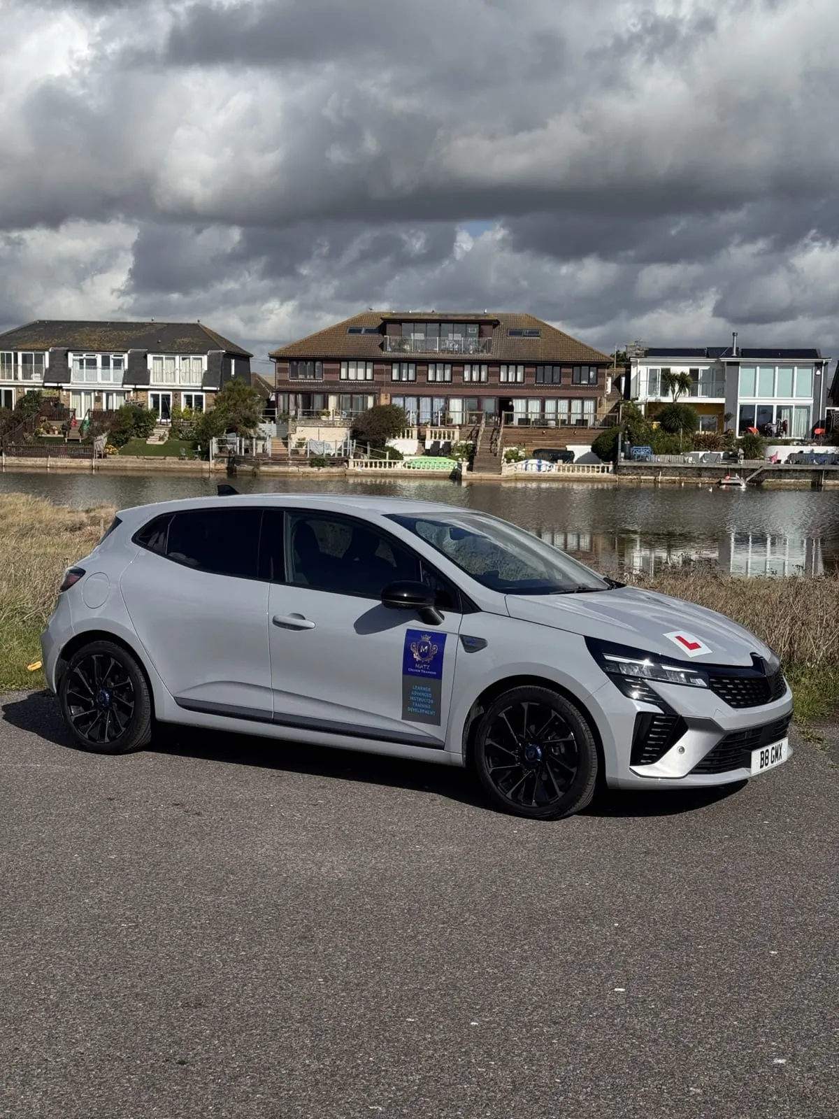 The Matz Driver Training tuition car, with its L plate, parked by the water